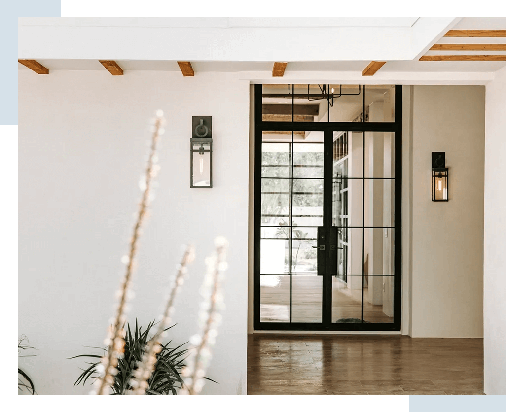 A door that is open and has plants in it.