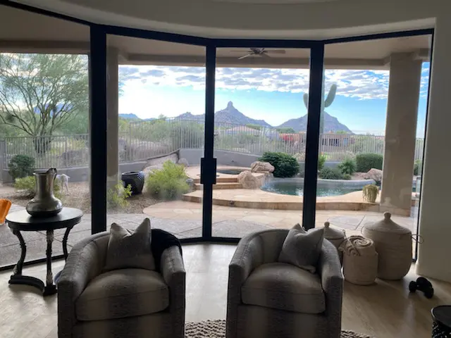 A living room with two chairs and a table